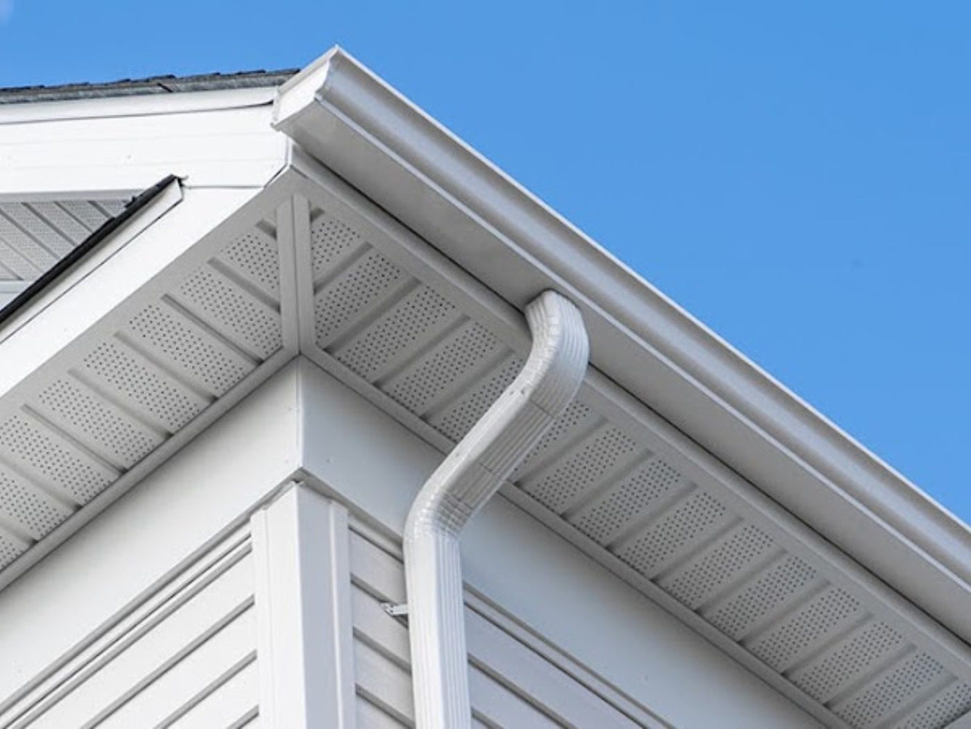 white gutter on fascia board laid with a
